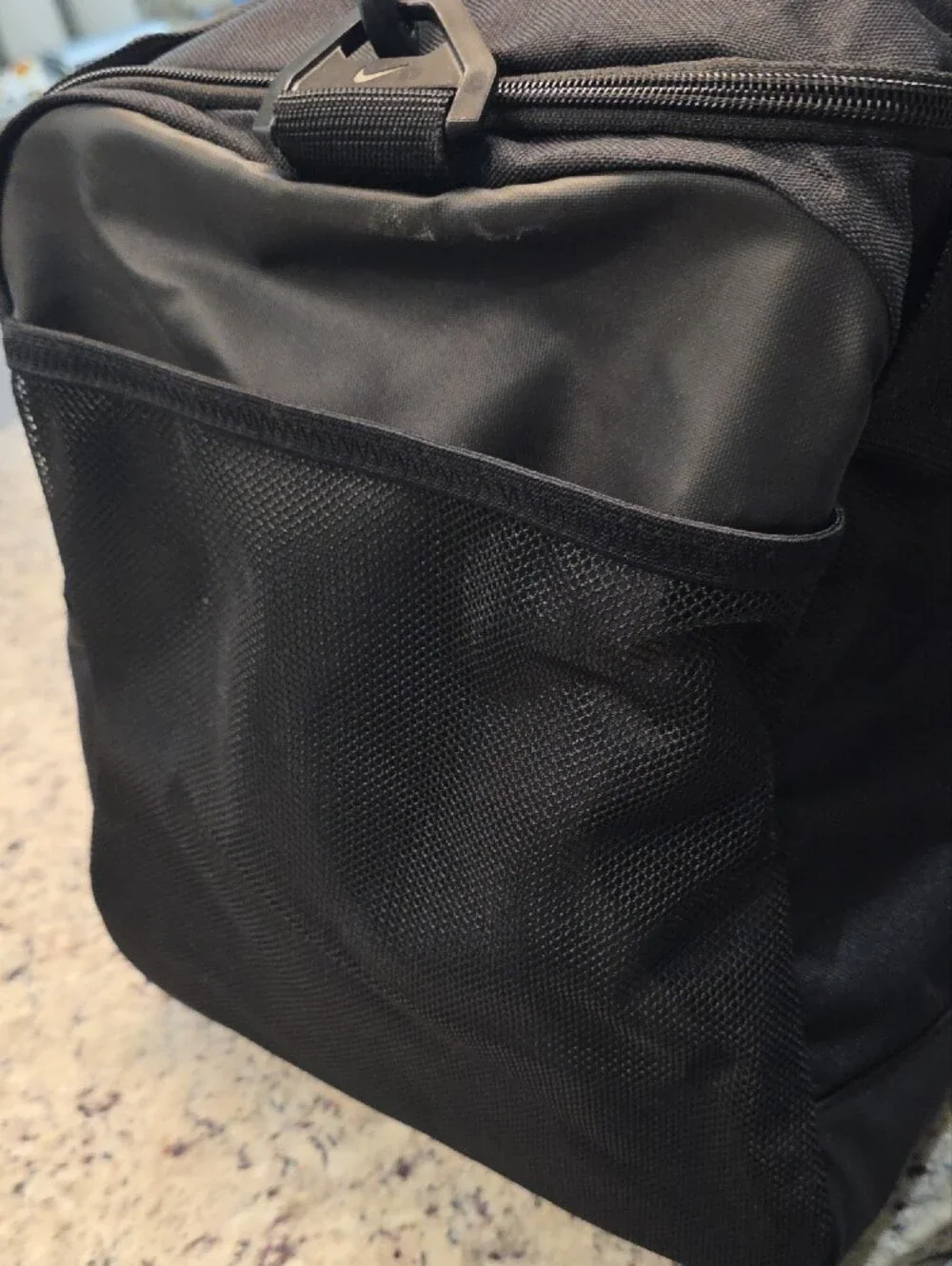 Nike Black Duffel Bag with White Swoosh and Branded Strap